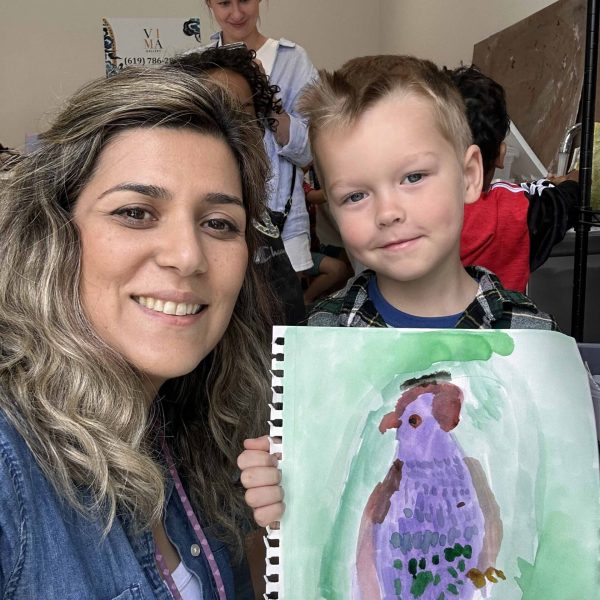 Home 14 Young student holding a watercolor bird painting during a beginner art class at VIMA Gallery San Diego